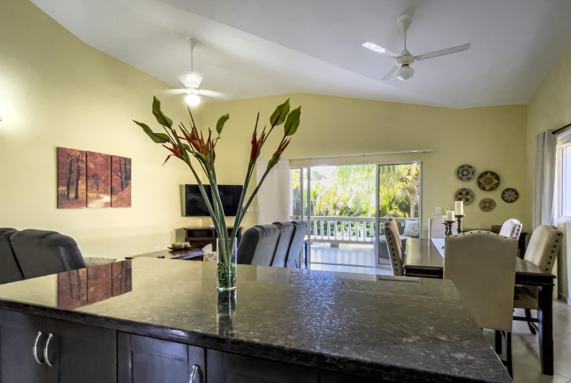 buyDRproperty Stunning 2 Bedroom Villa kitchen interior with island and dining area. Sosua Real Estate