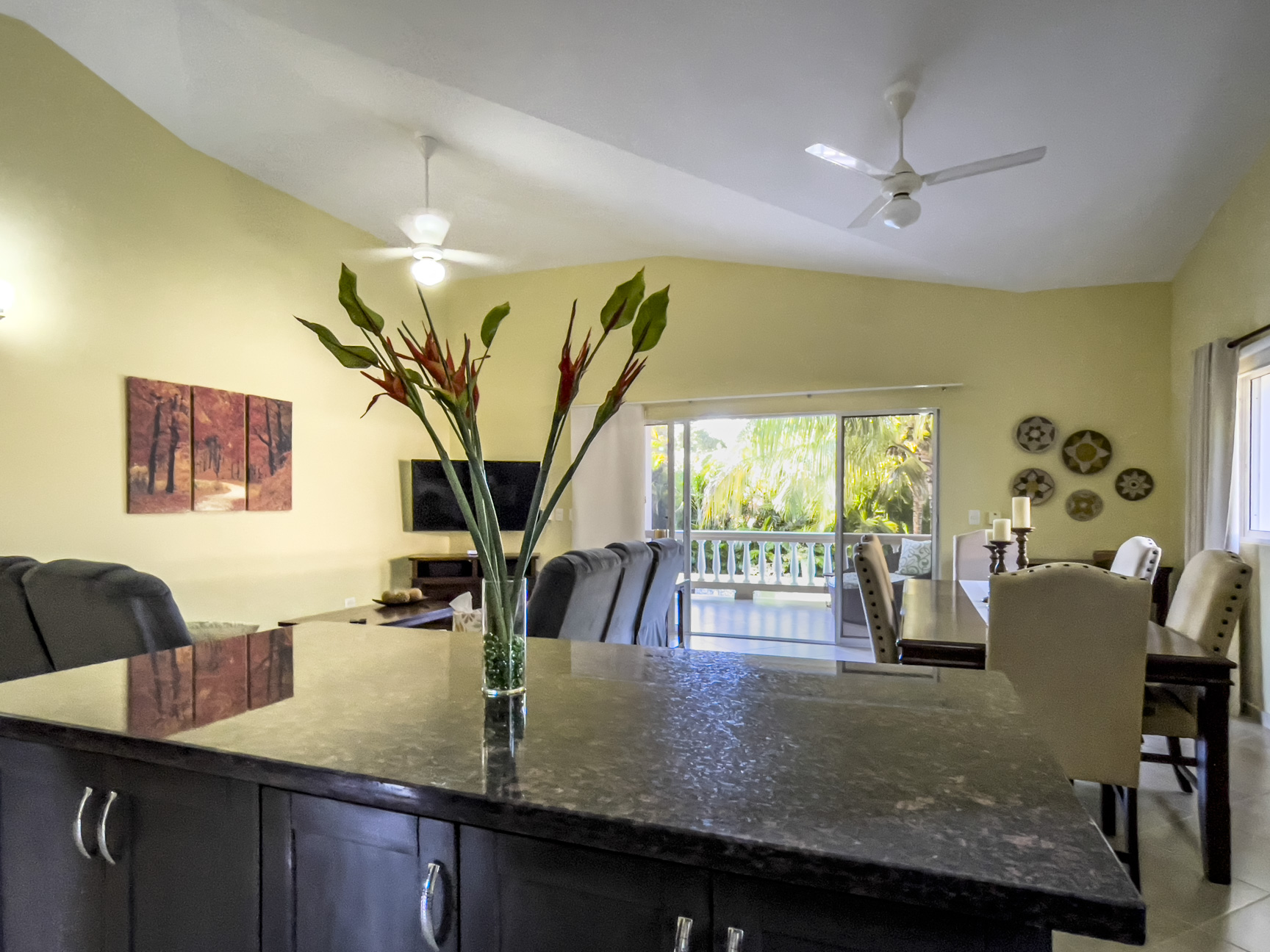 buyDRproperty Stunning 2 Bedroom Villa kitchen interior with island and dining area. Sosua Real Estate