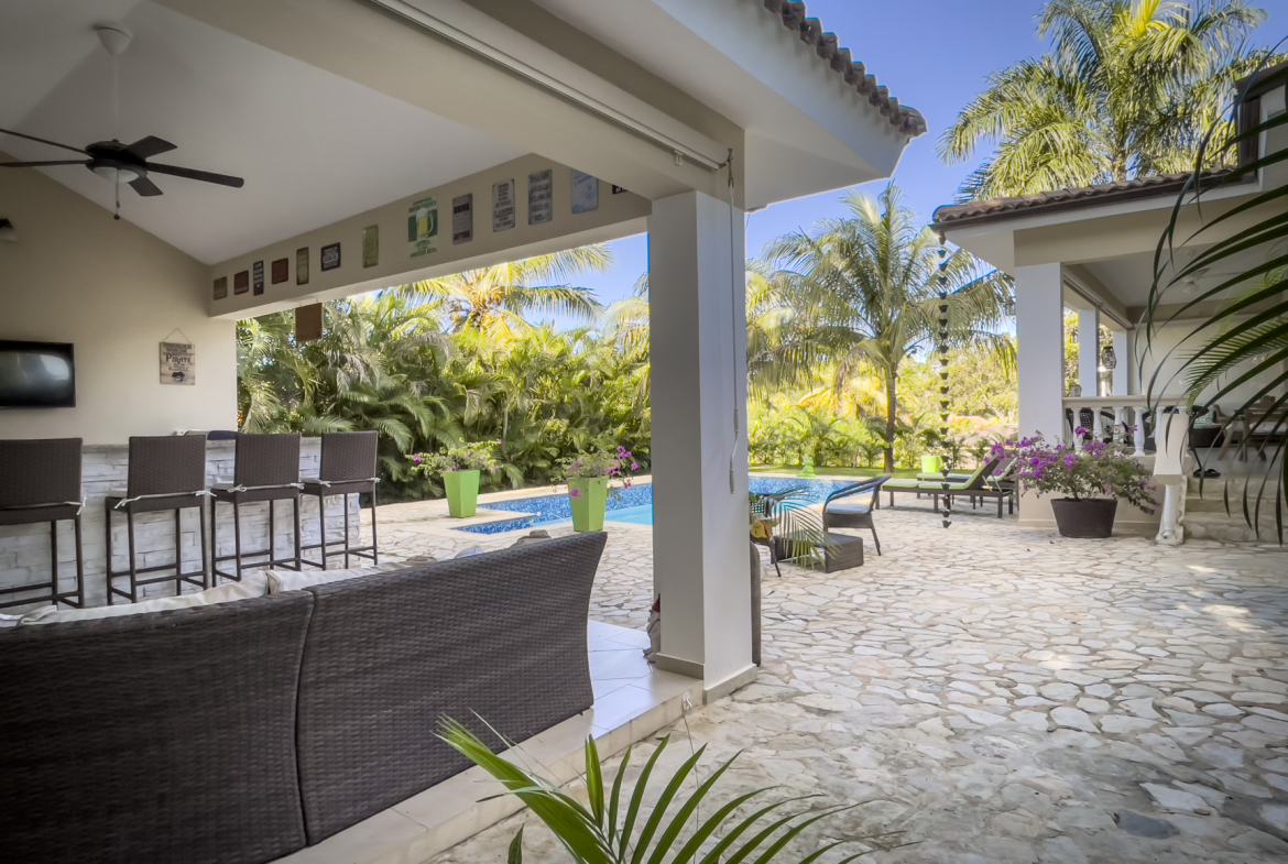 buyDRproperty Outdoor patio of a stunning 2 bedroom villa with pool access. Sosua Real Estate