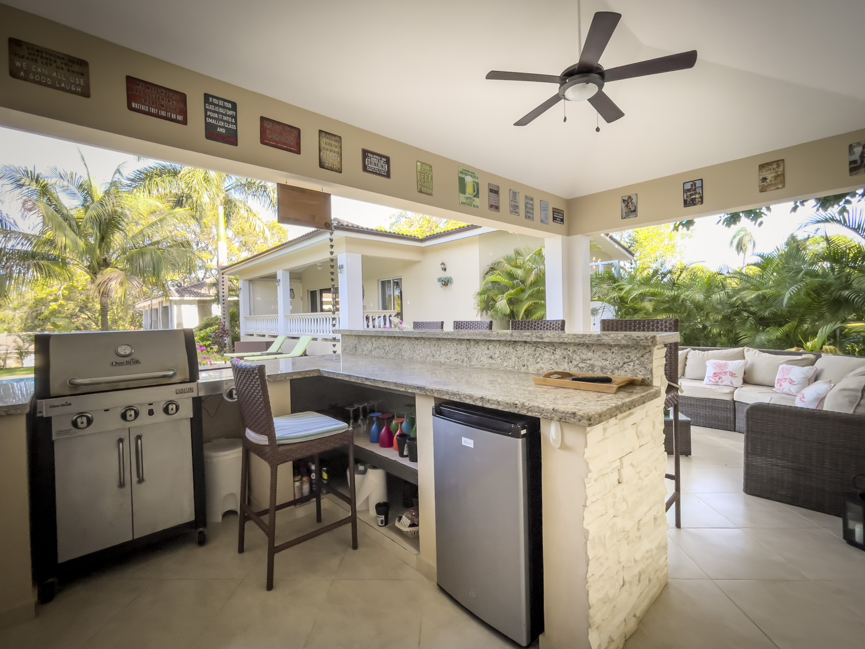 buyDRproperty Outdoor kitchen with a Char-Broil grill and bar, part of a stunning 2 bedroom villa. Sosua Real Estate