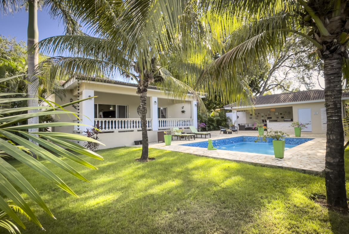 buyDRproperty Stunning 2 bedroom villa with pool, surrounded by palm trees and lush greenery. Sosua Real Estate