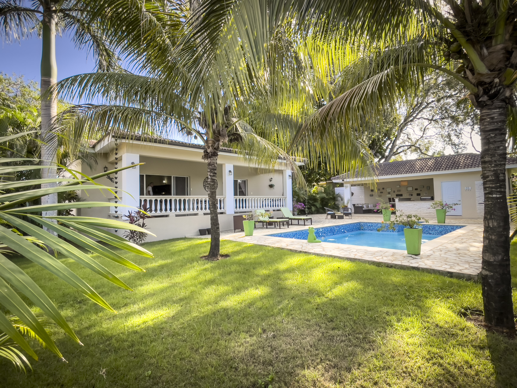 buyDRproperty Stunning 2 bedroom villa with pool, surrounded by palm trees and lush greenery. Sosua Real Estate