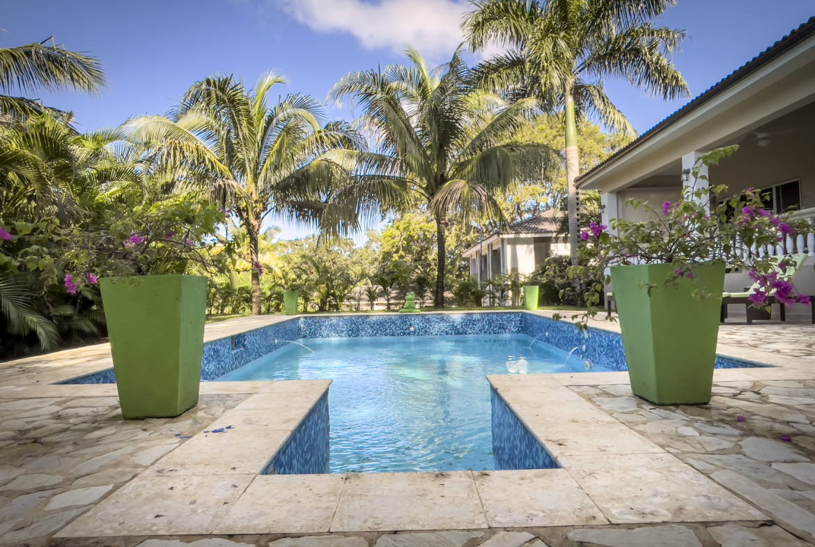 buyDRproperty Stunning 2 Bedroom Villa with pool surrounded by palm trees Sosua Real Estate