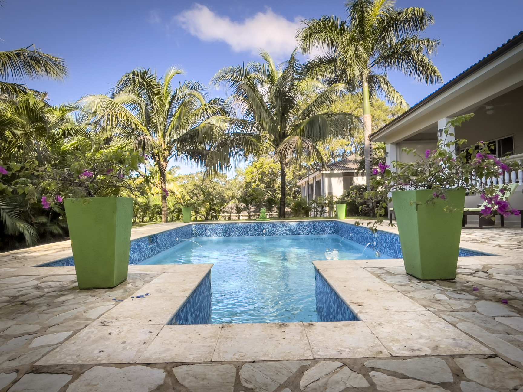 buyDRproperty Stunning 2 Bedroom Villa with pool surrounded by palm trees Sosua Real Estate