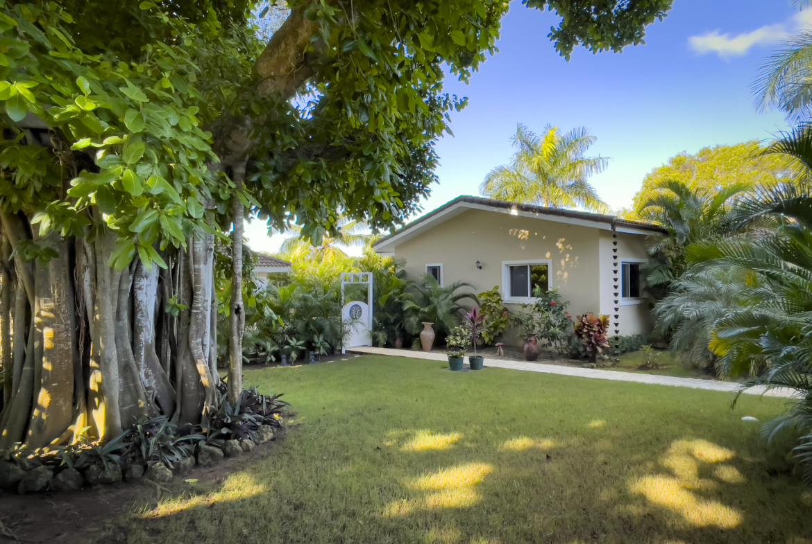 buyDRproperty Stunning 2 bedroom villa with lush landscaping and a beautiful lawn. Sosua Real Estate