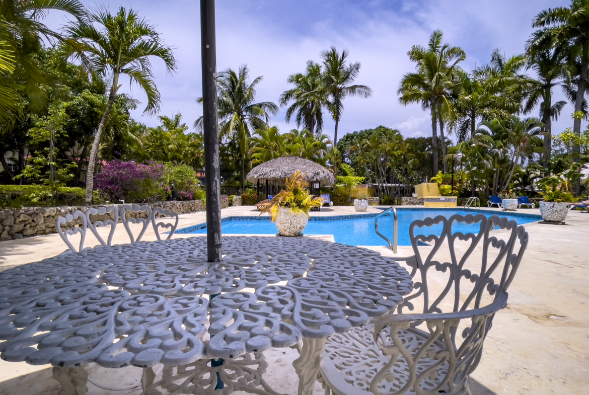 Condo For Sale In Trade Winds Patio and Pool Area