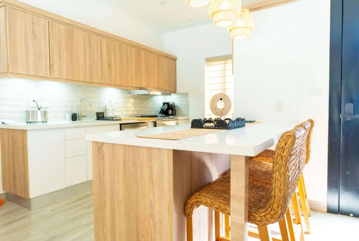 Villa Capri Casa Linda: Modern kitchen with island and bar stools in 2BR Sosua villa.