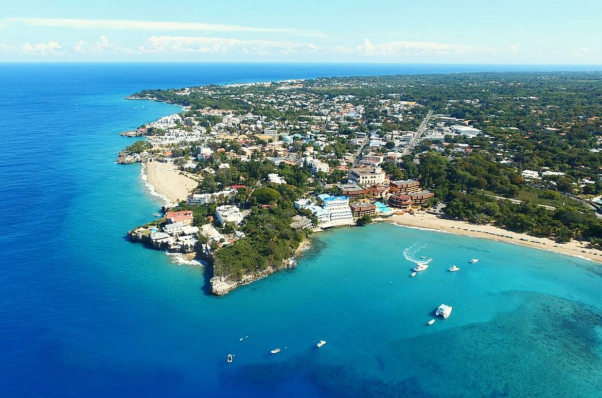 buyDRproperty Aerial view of the North Coast DR with turquoise water and a beach Sosua Real Estate