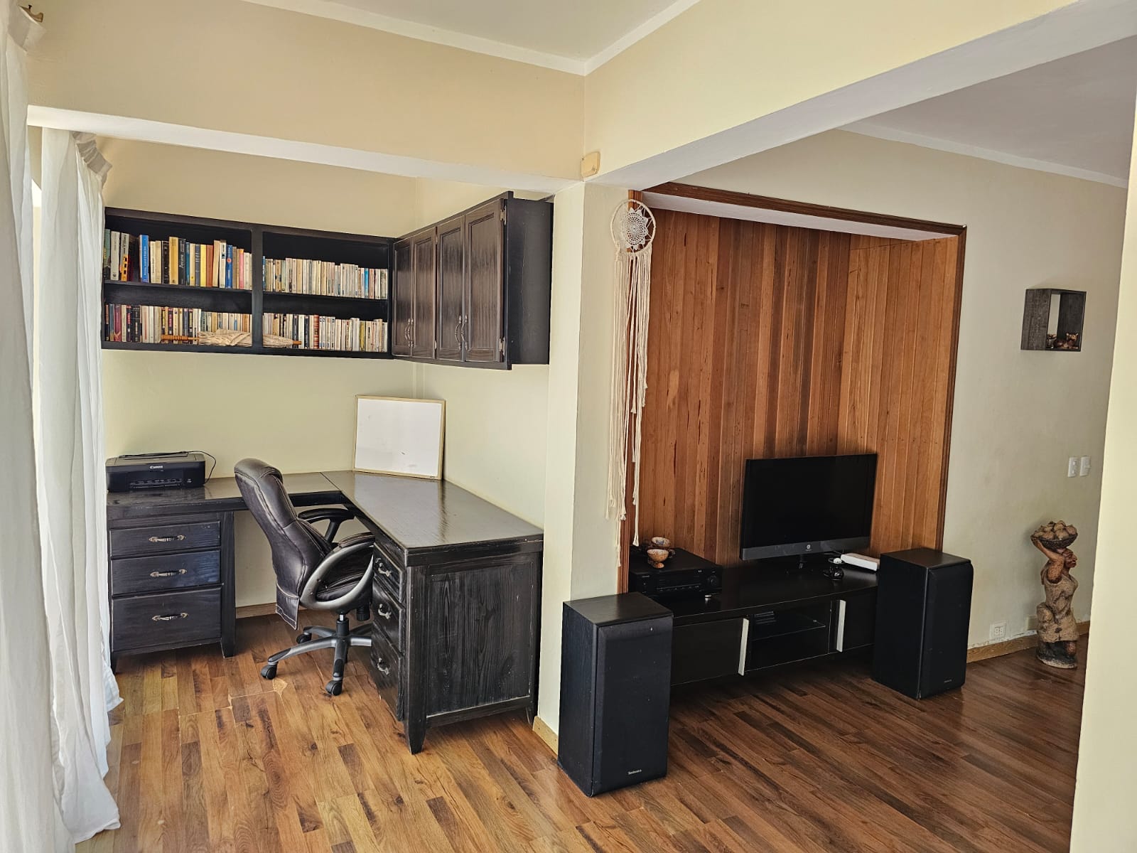 buyDRproperty Home office and living room in a spacious Sosua villa. Unique built-in desk and shelving. Sosua Real Estate