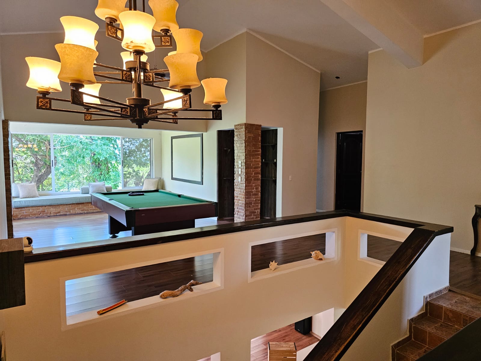 buyDRproperty Spacious Sosua villa with a pool table and large windows offering beautiful views. Sosua Real Estate