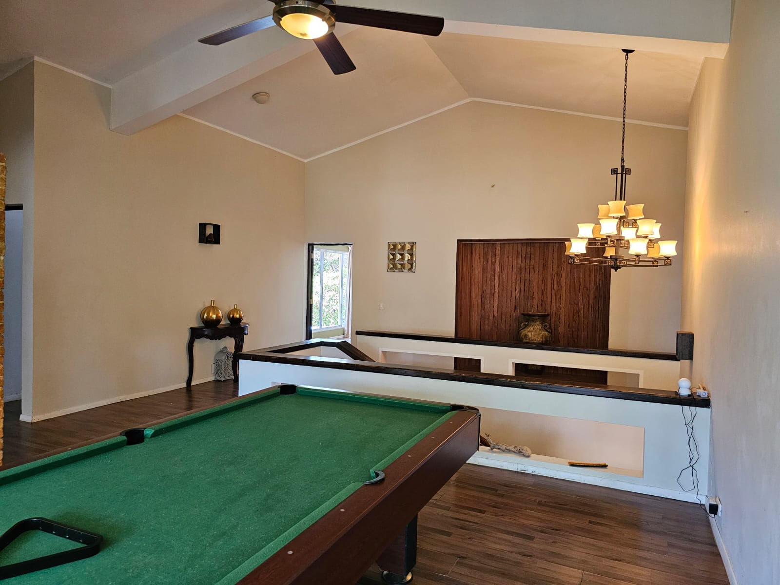 buyDRproperty Spacious villa interior with pool table and unique architectural features. Sosua Real Estate