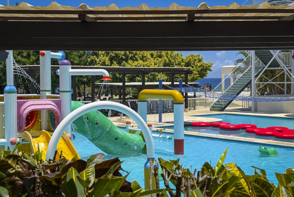 buyDRproperty Water park with slides and water features at a resort Sosua Real Estate