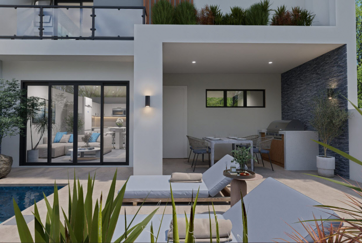 buyDRproperty Modern townhouse exterior with pool and outdoor dining area. Sosua Real Estate