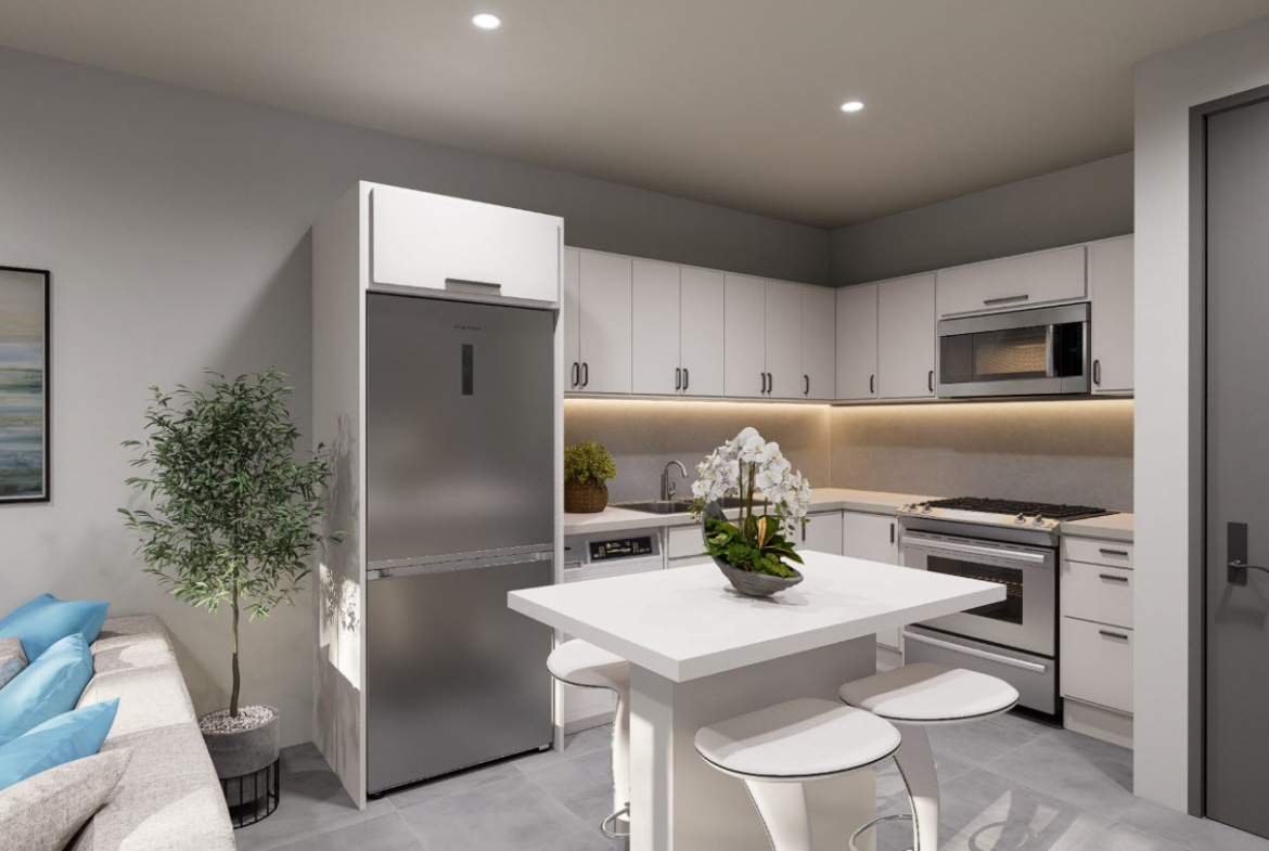 buyDRproperty Modern kitchen in a Casa Linda townhouse with white cabinets and island. Sosua Real Estate