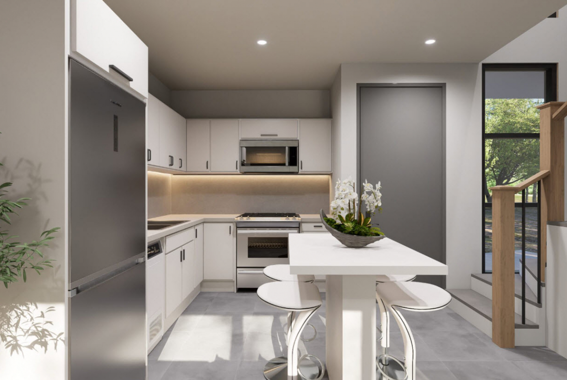 buyDRproperty Modern kitchen with white cabinets, stainless steel appliances, and a breakfast bar in a Casa Linda townhouse. Sosua Real Estate