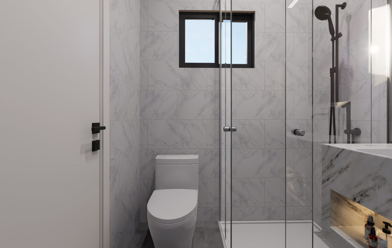 buyDRproperty Modern bathroom in a Casa Linda townhouse with glass shower and marble-look tiles. Sosua Real Estate