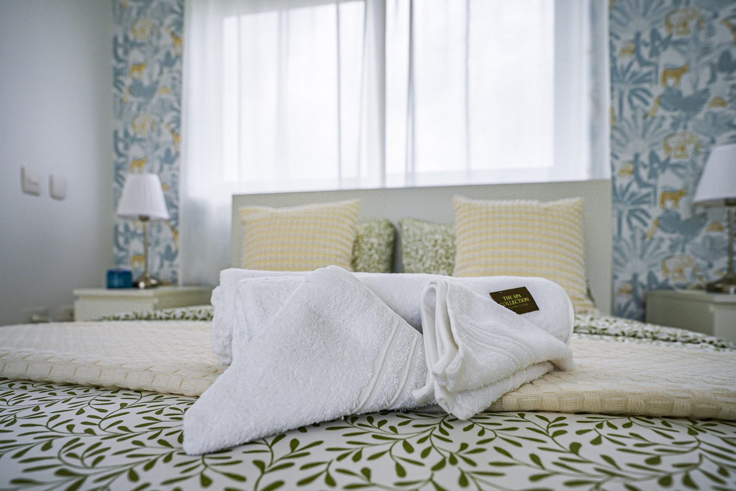 buyDRproperty White towels folded on a bed in a modern bedroom at Sosua Ocean Village. Sosua Real Estate