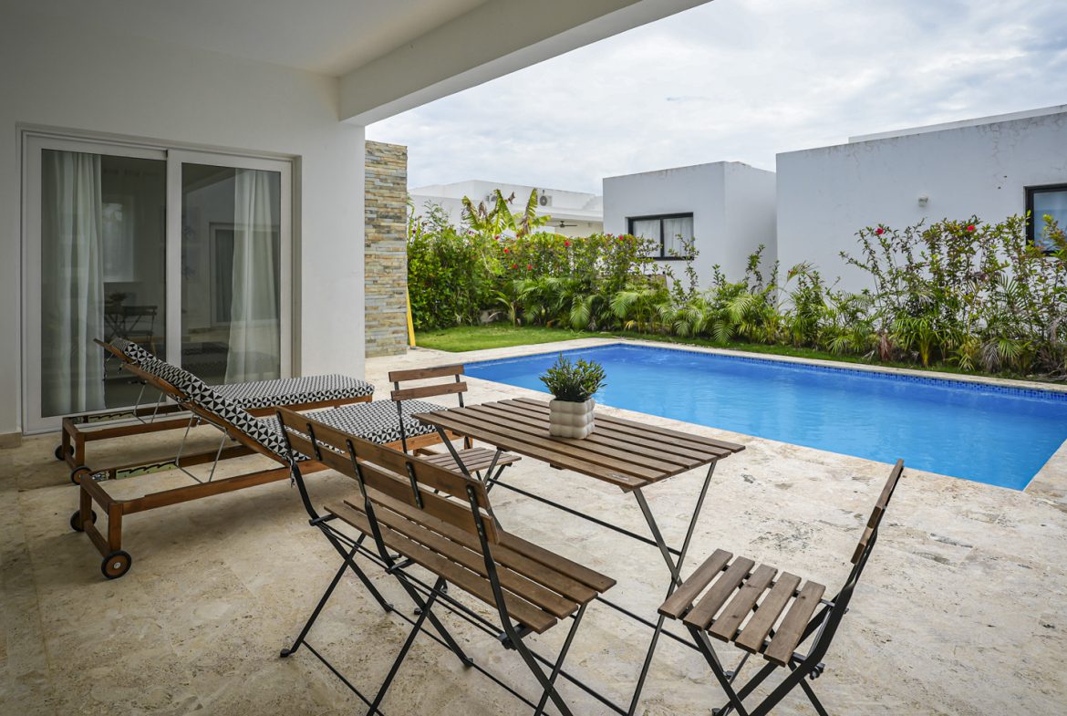 buyDRproperty Modern villa with a pool and outdoor seating Sosua Real Estate