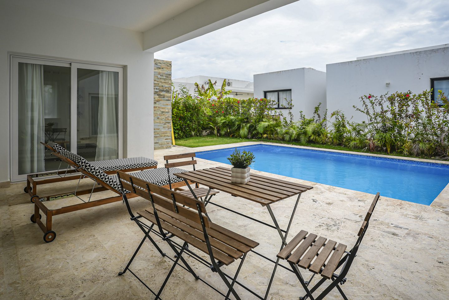 buyDRproperty Modern villa with a pool and outdoor seating Sosua Real Estate