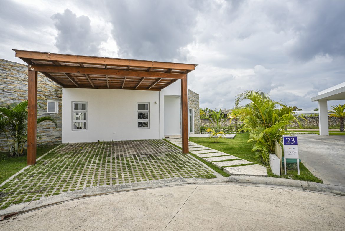 buyDRproperty Modern villa with carport and grass driveway in Sosua Ocean Village. Sosua Real Estate