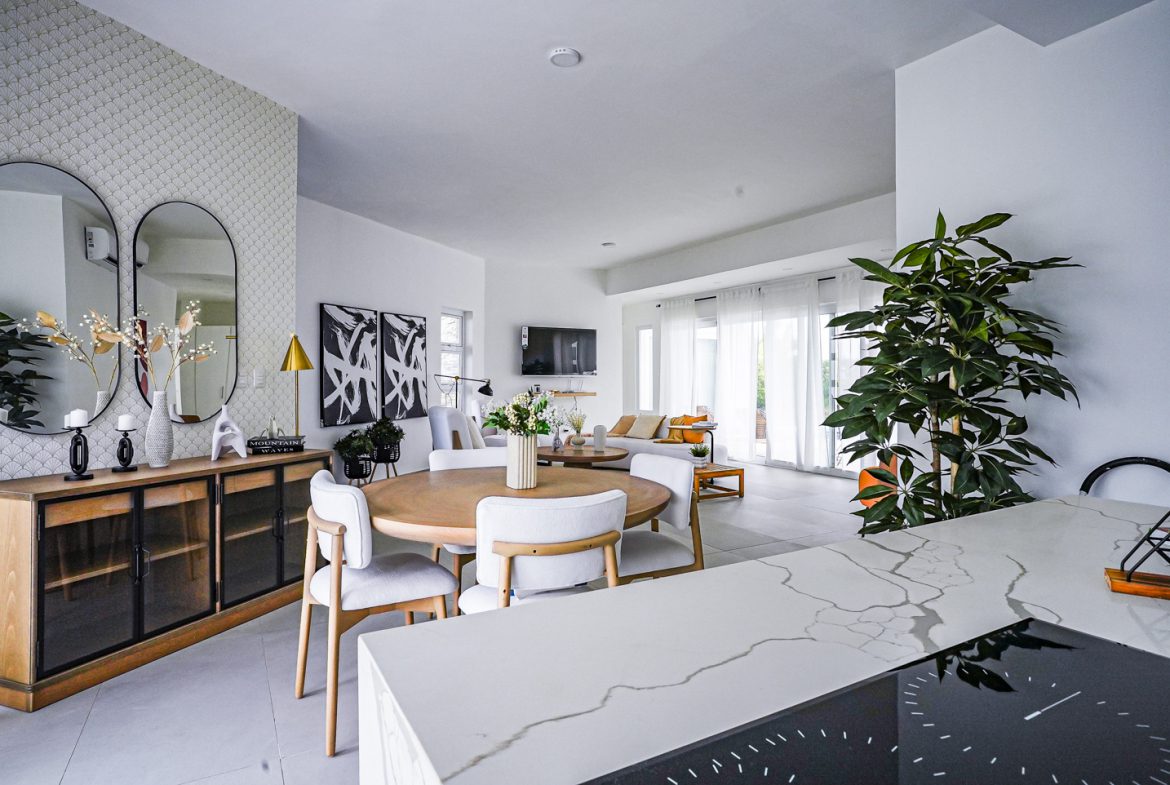 buyDRproperty Modern living room with dining area and kitchen island in a villa Sosua Real Estate