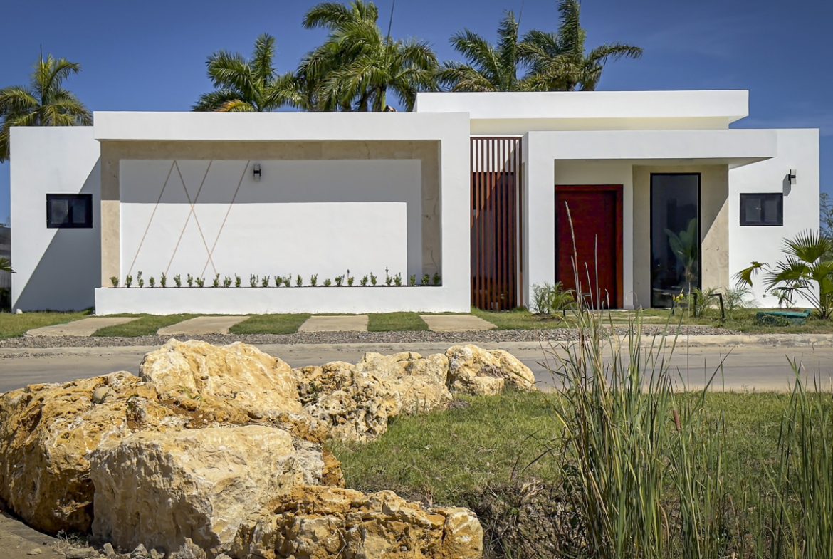 buyDRproperty Modern white luxury villa with private pool and tropical landscaping in Sosua Ocean Village