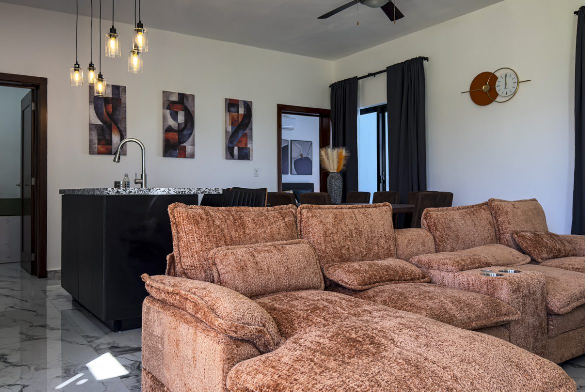 buyDRproperty Modern living room in a 3BR Villa Sosua Ocean Village with stylish decor and comfortable seating. Sosua Real Estate