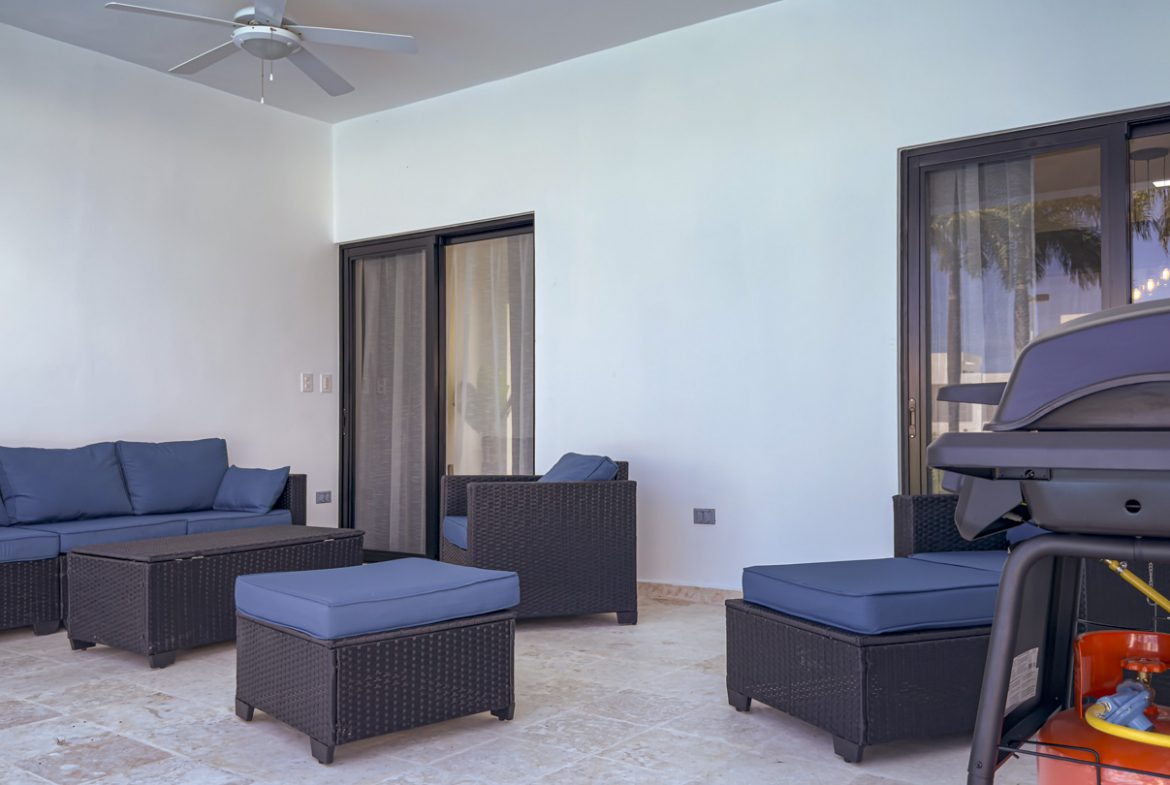 buyDRproperty Outdoor patio with modern furniture and grill at a villa in Sosua Ocean Village. Sosua Real Estate