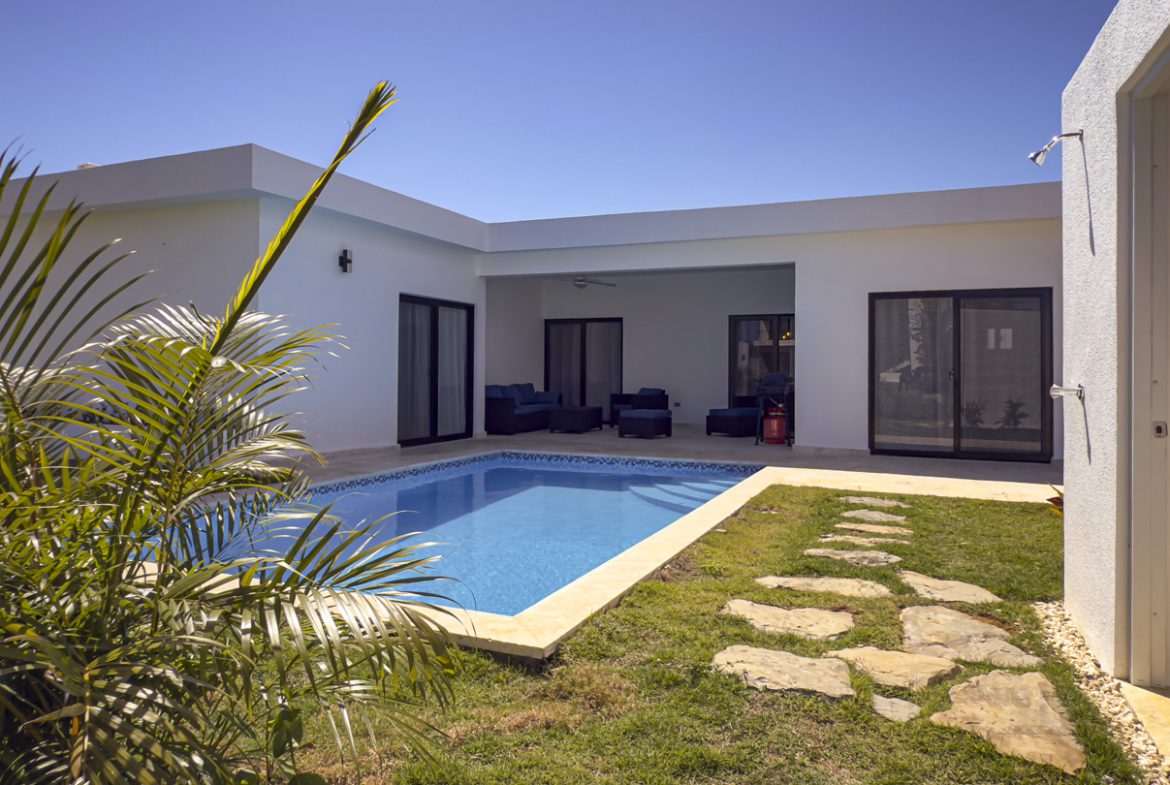 buyDRproperty Modern villa with a pool and outdoor seating in Sosua Ocean Village. Sosua Real Estate