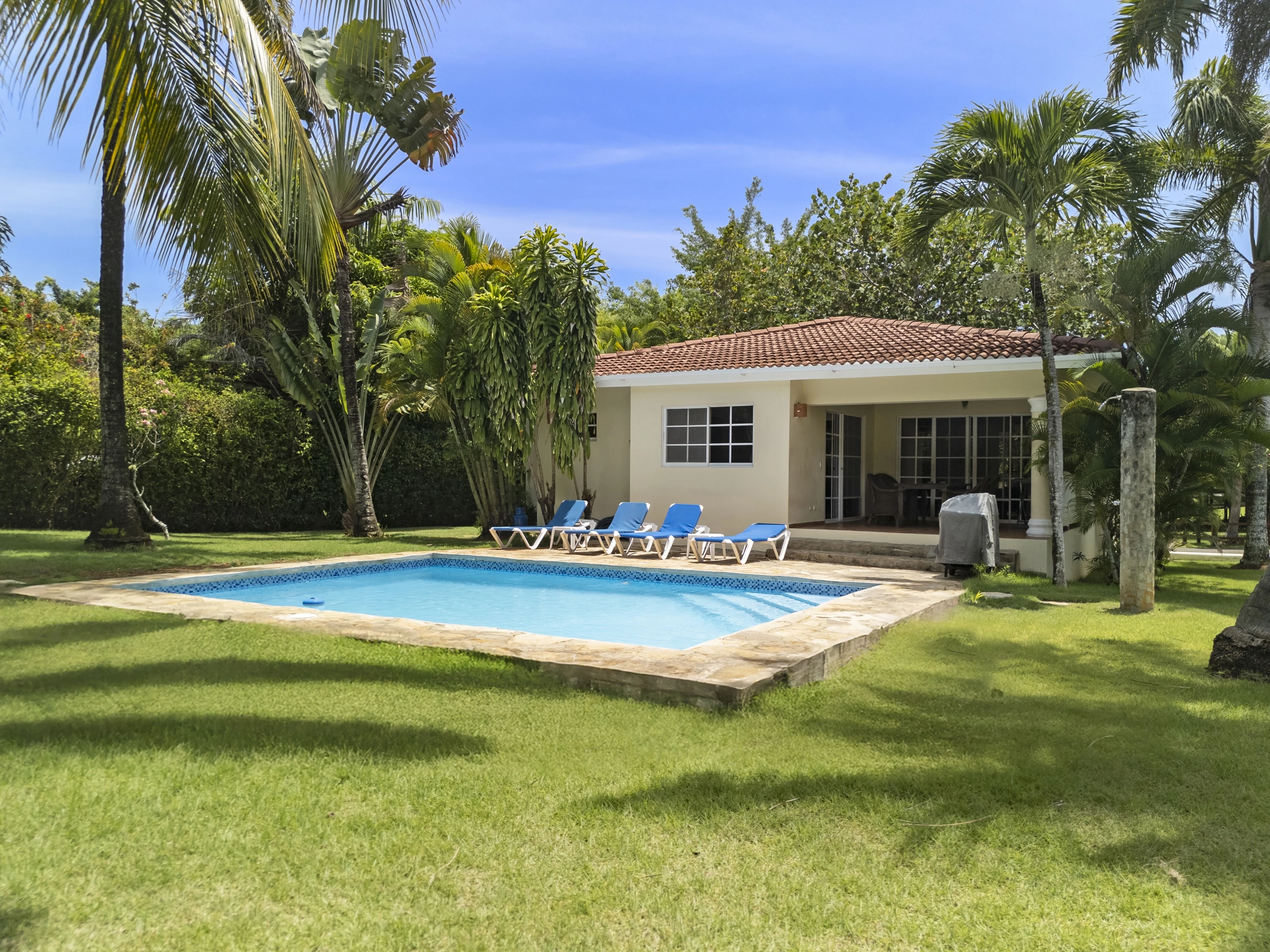 buyDRproperty Villa for sale in Sosua, Dominican Republic, with pool and palm trees. Sosua Real Estate