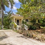 Buydrproperty Two bedroom Villa for Sale in Sosua with Tropical Landscaping and Palm Trees Sosua Real Estate Buydrpropertycom Buydrpropertycom