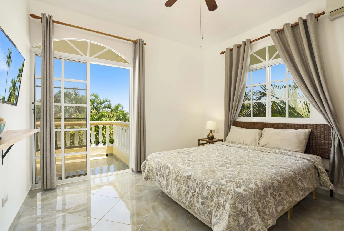 buyDRproperty Beautiful bedroom in a villa with a balcony view. Sosua Real Estate