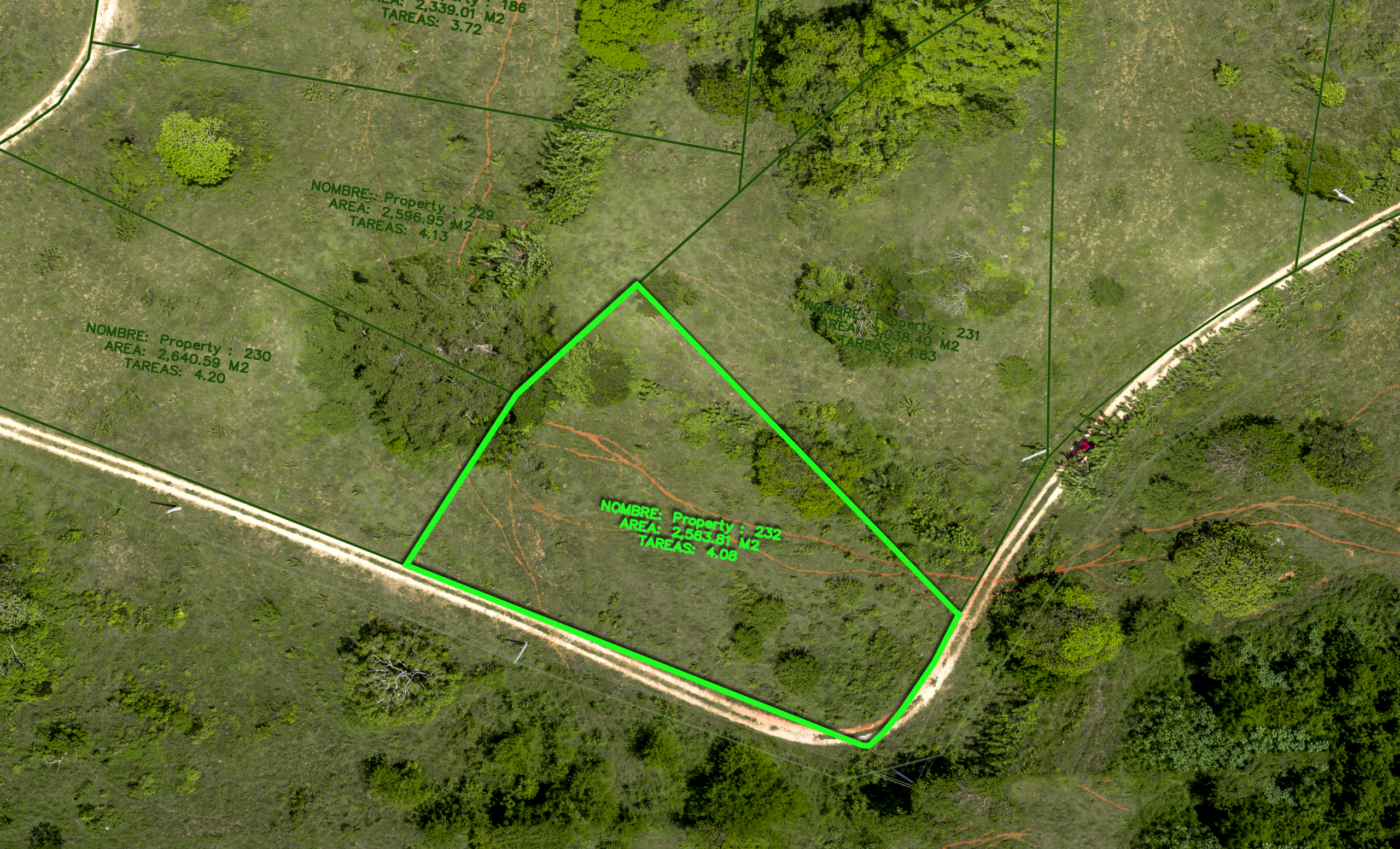 buyDRproperty Aerial view of a green-outlined land plot with surrounding trees and paths Sosua Real Estate