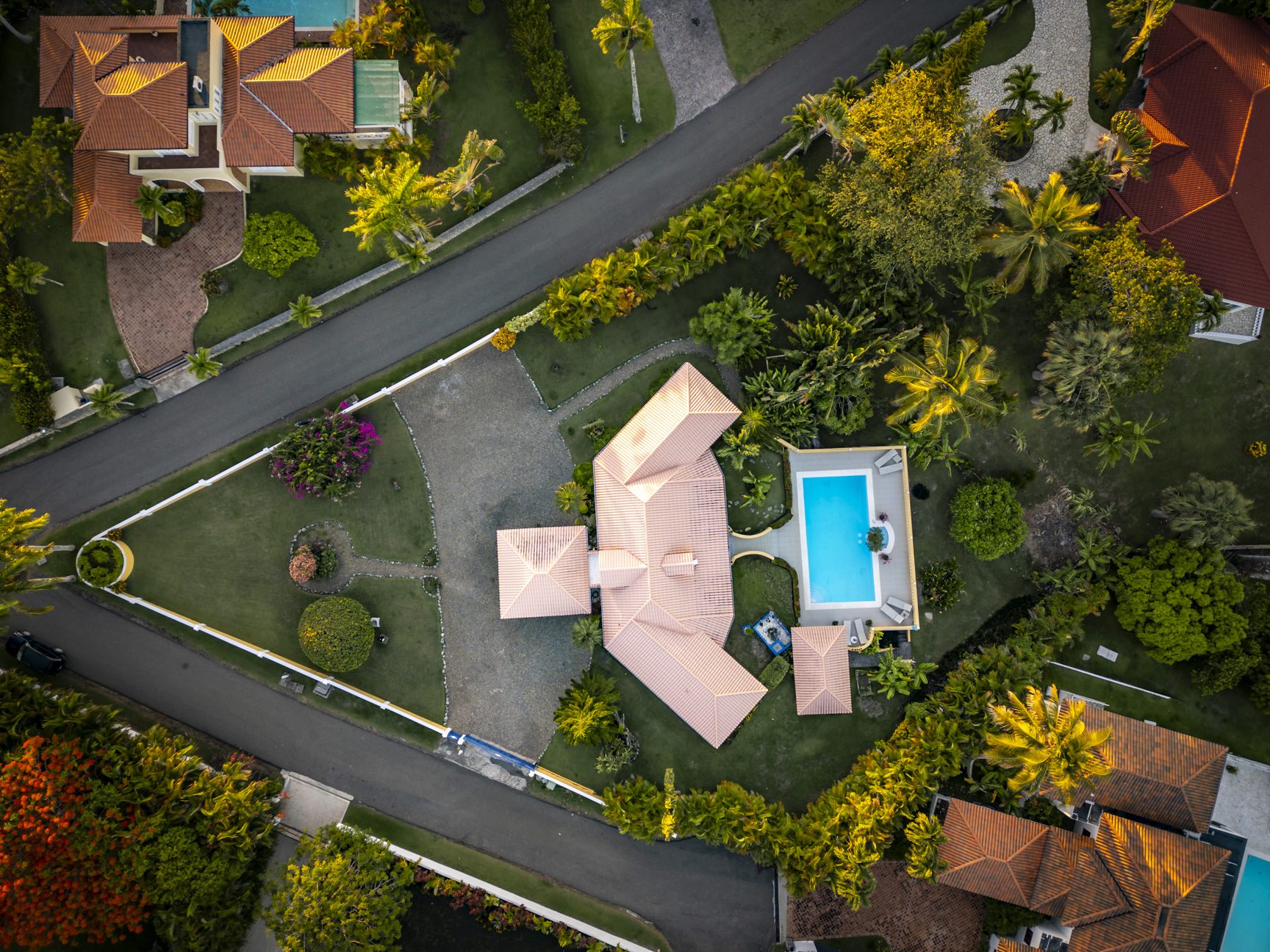 buyDRproperty Aerial view of a luxury villa with a pool, showcasing its lush landscaping and prime location. Ocean Views. Sosua Real Estate