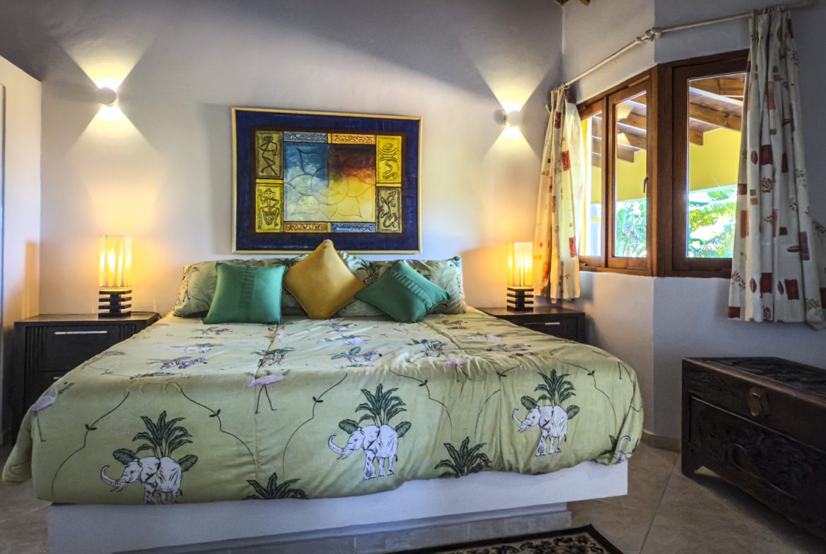 buyDRproperty Bedroom in an Ocean View Villa with elephant print bedding Sosua Real Estate