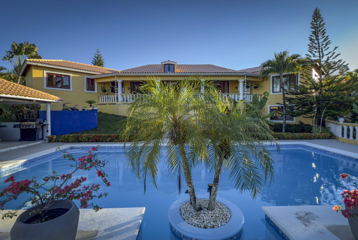 buyDRproperty Luxury villa with pool and palm trees. Ocean views villa for sale in Panorama Village. Sosua Real Estate