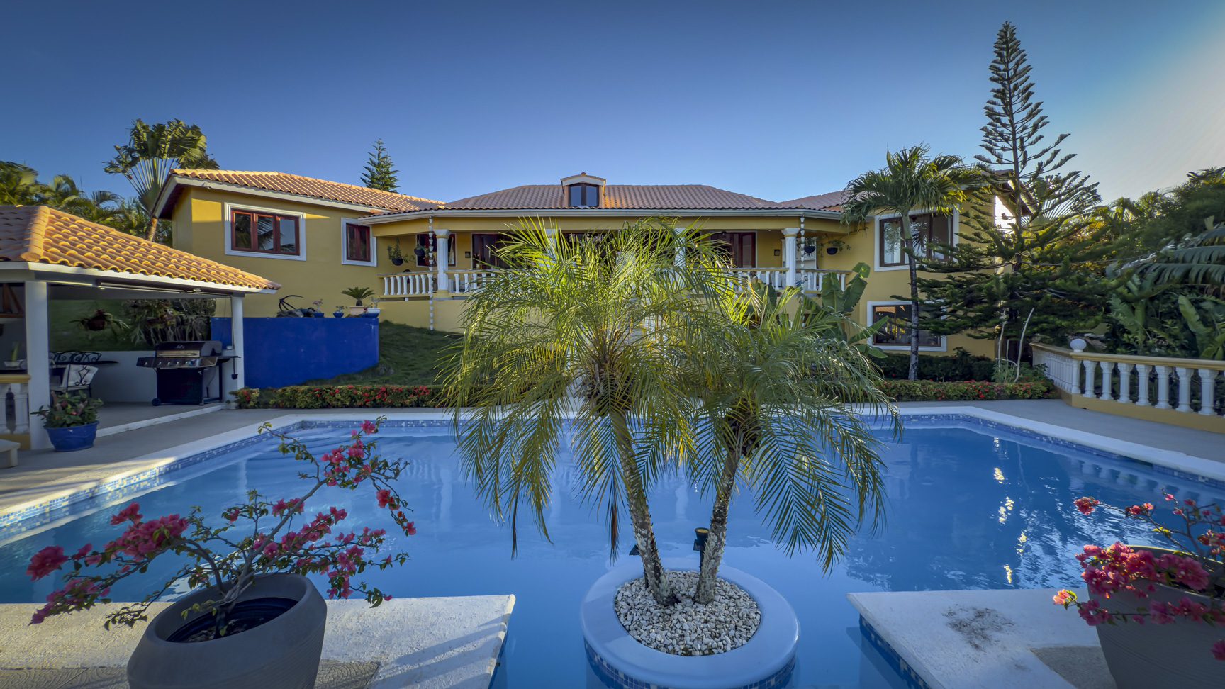 buyDRproperty Luxury villa with pool and palm trees. Ocean views villa for sale in Panorama Village. Sosua Real Estate