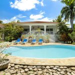 Buydrproperty Luxury Ocean View Villa with a Pool and Lounge Chairs in Residential Hispaniola Sosua Real Estate Buydrpropertycom Buydrpropertycom