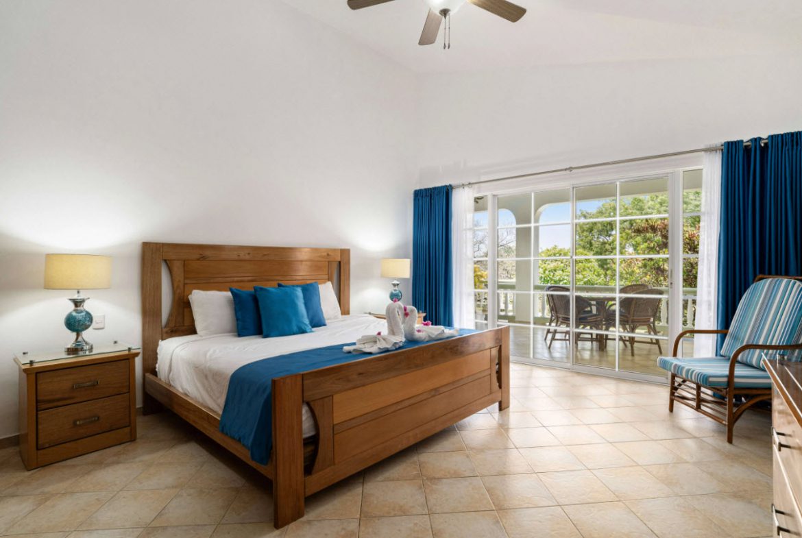 buyDRproperty Bedroom with ocean view access in a Residential Hispaniola villa. Sosua Real Estate