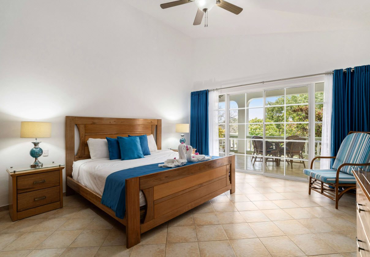 buyDRproperty Bedroom with ocean view access in a Residential Hispaniola villa. Sosua Real Estate