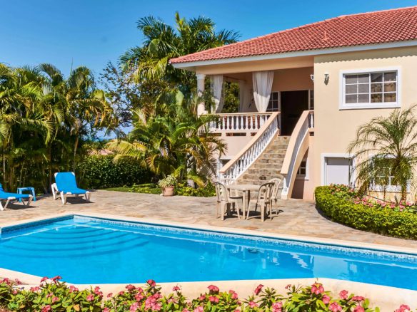 nice patio next to the pool and palmtrees