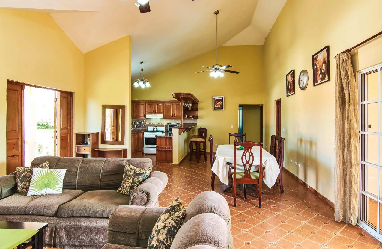 buyDRproperty Spacious living room with open kitchen in a Residential Hispaniola villa. Sosua Real Estate