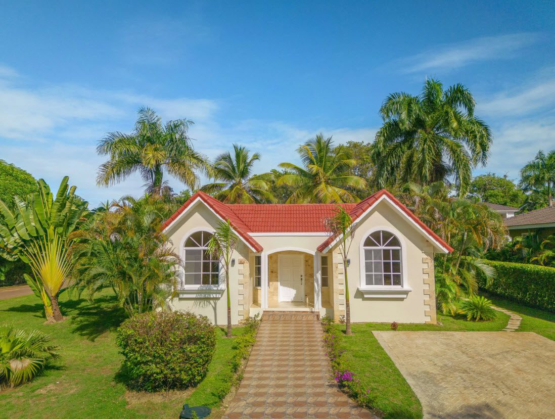 buyDRproperty Beautiful 3 BR Villa with red tile roof and lush landscaping in Sosúa. Sosua Real Estate