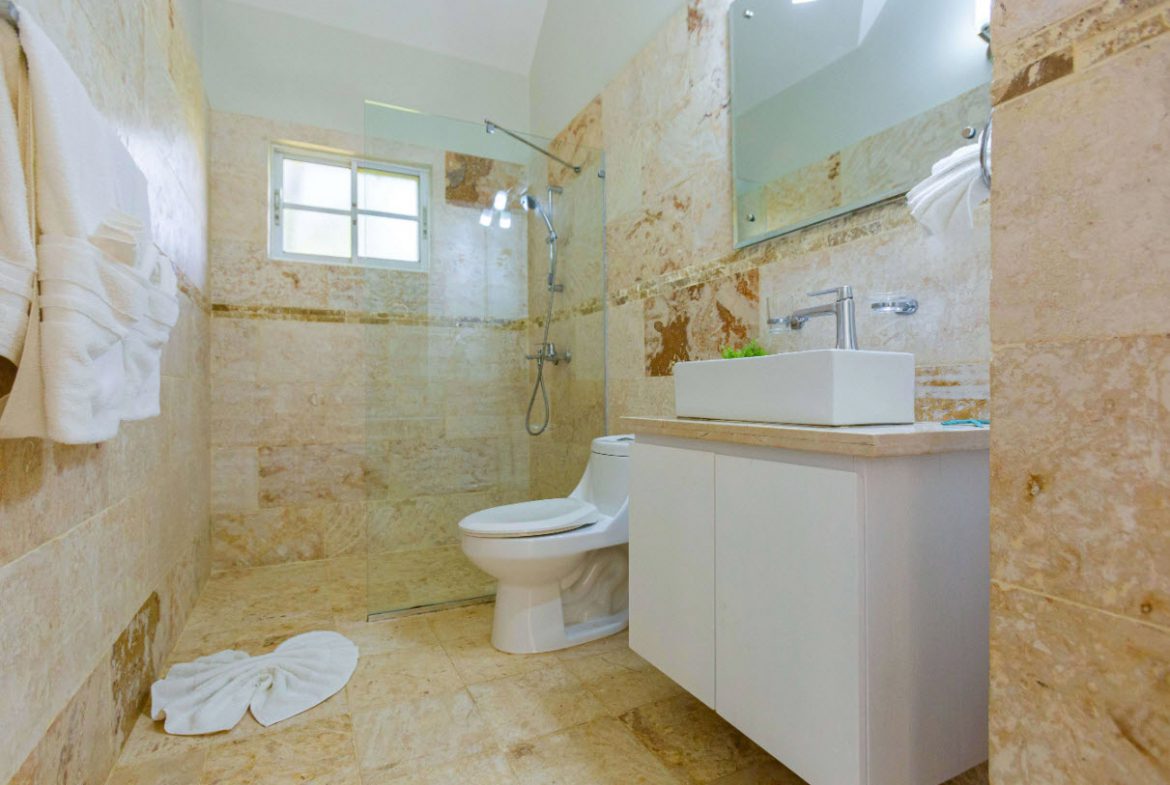 buyDRproperty Modern bathroom in a 3 BR Villa with shower, toilet, and sink. Sosua Real Estate