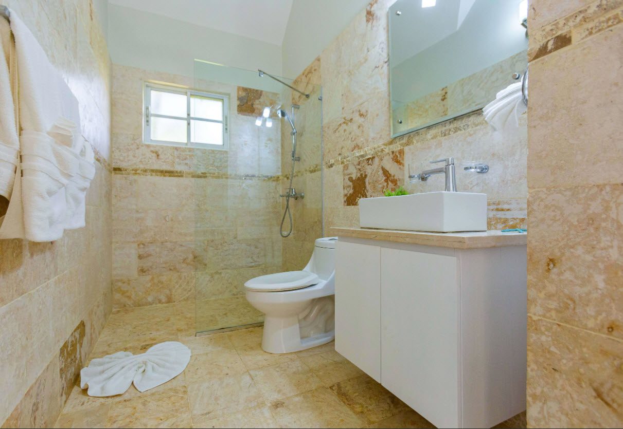 buyDRproperty Modern bathroom in a 3 BR Villa with shower, toilet, and sink. Sosua Real Estate