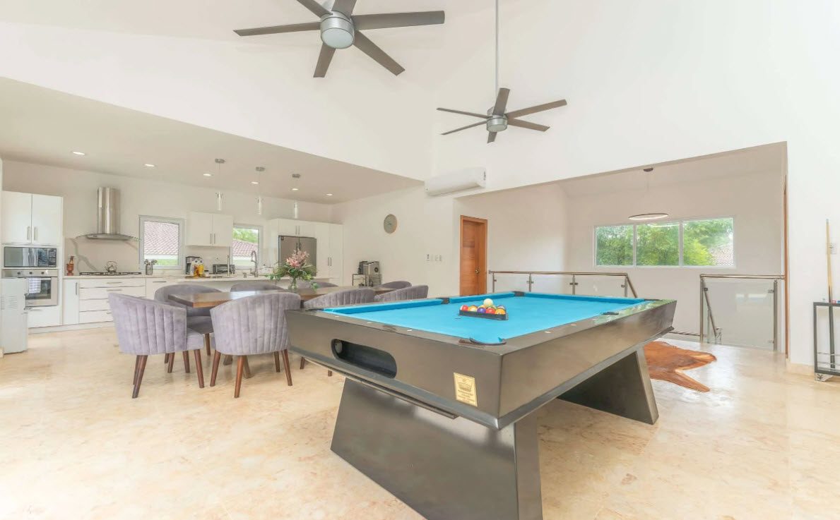 buyDRproperty open plan living room dining room with pooltable. Sosua Real Estate