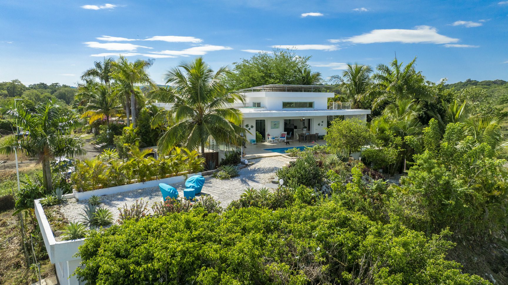 buyDRproperty Luxury villa with pool in Costa Rica, surrounded by tropical foliage. Sosua Real Estate