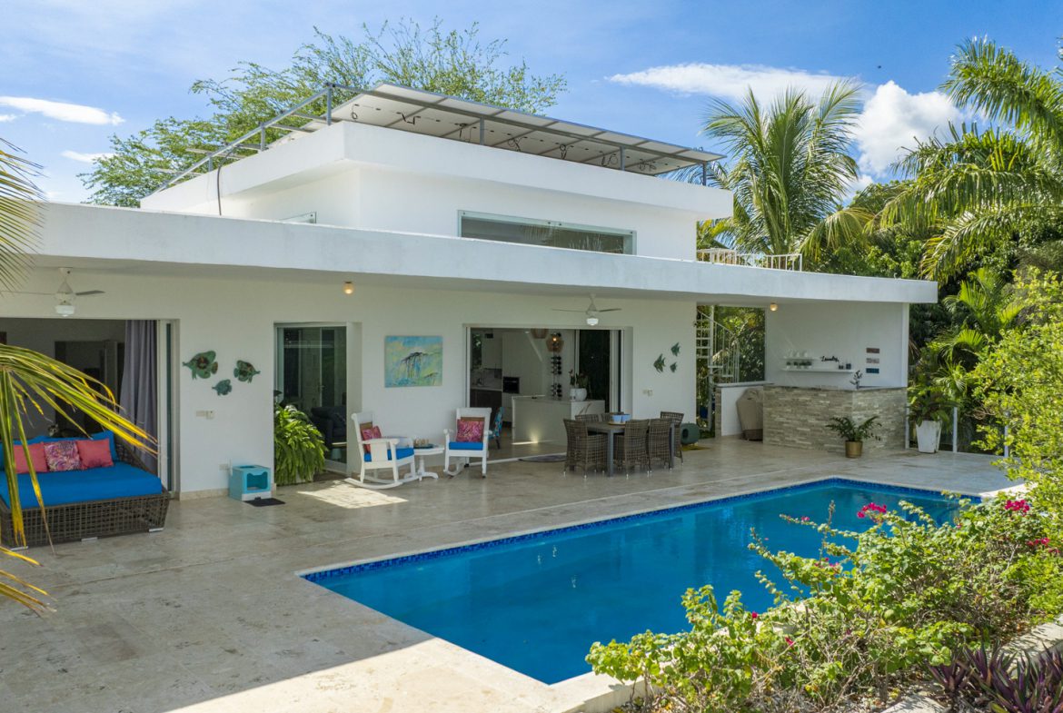 buyDRproperty Costa Rica home with pool and solar panels, promoting sustainable tropical living. Sosua Real Estate