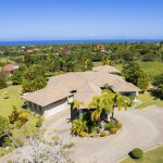 Buydrproperty Spacious Villa with Manicured Lawn and Ocean View Under Clear Blue Sky Sosua Real Estate Buydrpropertycom Buydrpropertycom