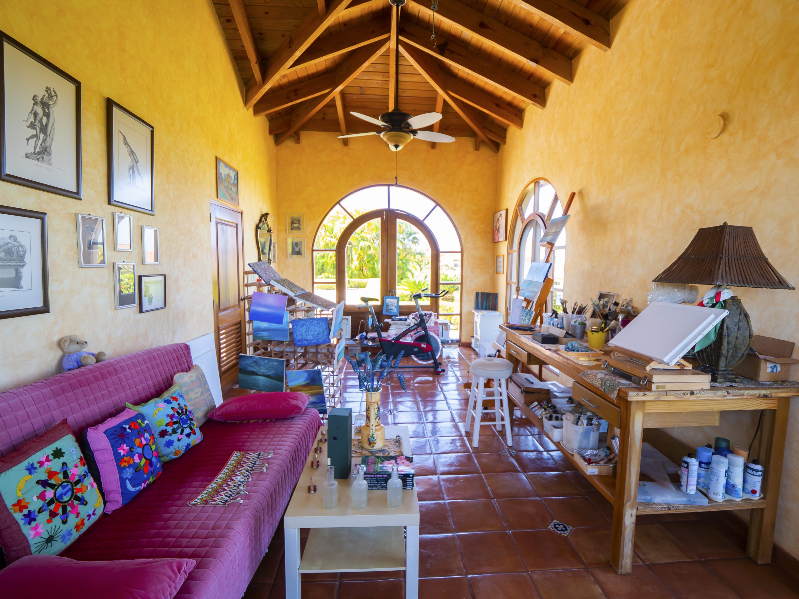 buyDRproperty Colorful art studio with arched windows and vibrant decor Sosua Real Estate